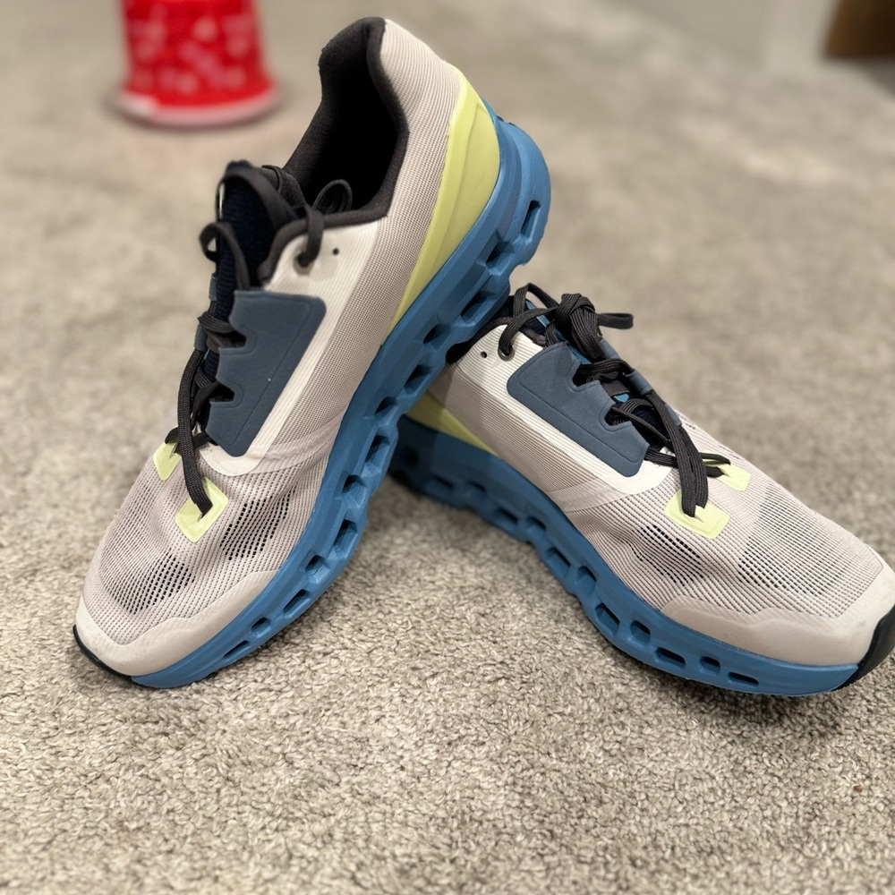 On Running Athletic Shoes in White, Blue, and Yellow